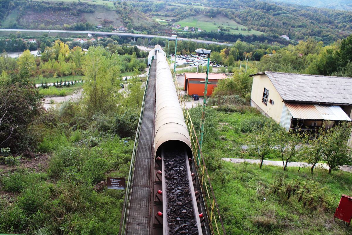 Coal moving along the conveyor belt at the RMU Kakanj Vrtlište plant, viewed from the overhead gantry