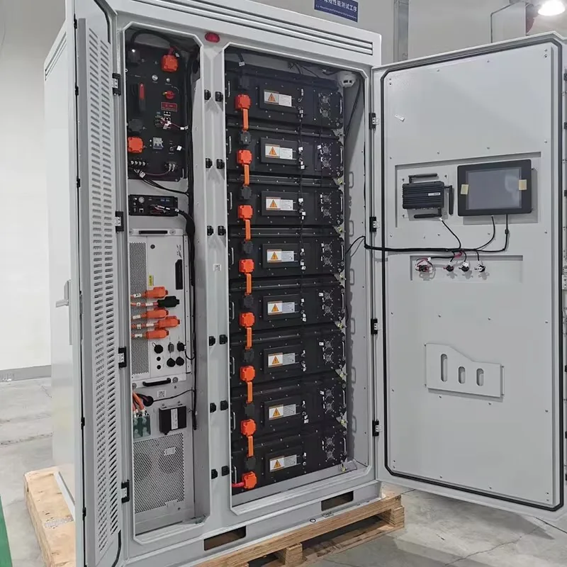 Open battery cabinet showing stacked battery modules, BMS and orange DC cabling