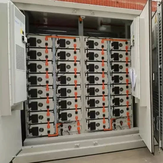 Interior of a battery container with battery modules racked in four columns and climate control